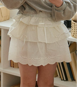 Cream skirt.